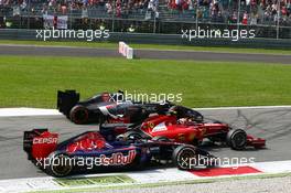 Jean-Eric Vergne (FRA) Scuderia Toro Rosso STR9, Kimi Raikkonen (FIN) Ferrari F14-T and Esteban Gutierrez (MEX) Sauber C33 at the start of the race. 07.09.2014. Formula 1 World Championship, Rd 13, Italian Grand Prix, Monza, Italy, Race Day.
