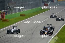 (L to R): Valtteri Bottas (FIN) Williams FW36 and Daniel Ricciardo (AUS) Red Bull Racing RB10 battle for position. 07.09.2014. Formula 1 World Championship, Rd 13, Italian Grand Prix, Monza, Italy, Race Day.