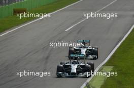 Nico Rosberg (GER) Mercedes AMG F1 W05 leads team mate Lewis Hamilton (GBR) Mercedes AMG F1 W05 shortly before out braking himself at the first chicane. 07.09.2014. Formula 1 World Championship, Rd 13, Italian Grand Prix, Monza, Italy, Race Day.