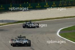 Lewis Hamilton (GBR) Mercedes AMG F1 W05 leads team mate Nico Rosberg (GER) Mercedes AMG F1 W05. 07.09.2014. Formula 1 World Championship, Rd 13, Italian Grand Prix, Monza, Italy, Race Day.