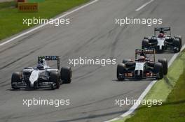 Valtteri Bottas (FIN) Williams FW36 and Sergio Perez (MEX) Sahara Force India F1 VJM07 battle for position. 07.09.2014. Formula 1 World Championship, Rd 13, Italian Grand Prix, Monza, Italy, Race Day.