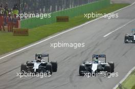 (L to R): Kevin Magnussen (DEN) McLaren MP4-29 and Felipe Massa (BRA) Williams FW36 battle for position. 07.09.2014. Formula 1 World Championship, Rd 13, Italian Grand Prix, Monza, Italy, Race Day.