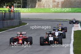 Kimi Raikkonen (FIN) Ferrari F14-T and Nico Hulkenberg (GER) Sahara Force India F1 VJM07 Battle for position. 07.09.2014. Formula 1 World Championship, Rd 13, Italian Grand Prix, Monza, Italy, Race Day.