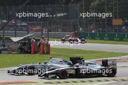 Valtteri Bottas (FIN) Williams FW36 and Kevin Magnussen (DEN) McLaren MP4-29 battle for position. 07.09.2014. Formula 1 World Championship, Rd 13, Italian Grand Prix, Monza, Italy, Race Day.