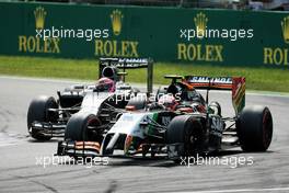 Sergio Perez (MEX) Sahara Force India F1 VJM07 leads Jenson Button (GBR) McLaren MP4-29. 07.09.2014. Formula 1 World Championship, Rd 13, Italian Grand Prix, Monza, Italy, Race Day.