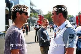 (L to R): Mark Webber (AUS) Porsche Team WEC Driver with Eric Boullier (FRA) McLaren Racing Director. 06.09.2014. Formula 1 World Championship, Rd 13, Italian Grand Prix, Monza, Italy, Qualifying Day.