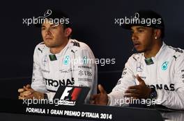 (L to R): Nico Rosberg (GER) Mercedes AMG F1 with team mate Lewis Hamilton (GBR) Mercedes AMG F1 in the post qualifying FIA Press Conference. 06.09.2014. Formula 1 World Championship, Rd 13, Italian Grand Prix, Monza, Italy, Qualifying Day.