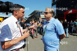 (L to R): Will Buxton (GBR) NBS Sports Network TV Presenter with Gene Haas (USA) Haas Automotion President. 06.09.2014. Formula 1 World Championship, Rd 13, Italian Grand Prix, Monza, Italy, Qualifying Day.