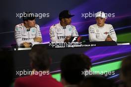 The post qualifying FIA Press Conference (L to R): Nico Rosberg (GER) Mercedes AMG F1, second; Lewis Hamilton (GBR) Mercedes AMG F1, pole position; Valtteri Bottas (FIN) Williams, third. 06.09.2014. Formula 1 World Championship, Rd 13, Italian Grand Prix, Monza, Italy, Qualifying Day.