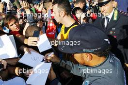 Lewis Hamilton (GBR) Mercedes AMG F1 signs autographs for the fans. 06.09.2014. Formula 1 World Championship, Rd 13, Italian Grand Prix, Monza, Italy, Qualifying Day.