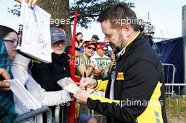 Paul Hembery (GBR) Pirelli Motorsport Director signs autographs for the fans. 06.09.2014. Formula 1 World Championship, Rd 13, Italian Grand Prix, Monza, Italy, Qualifying Day.