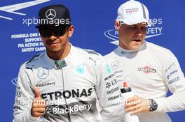 (L to R): Lewis Hamilton (GBR) Mercedes AMG F1 celebrates his pole position in parc ferme with third placed Valtteri Bottas (FIN) Williams. 06.09.2014. Formula 1 World Championship, Rd 13, Italian Grand Prix, Monza, Italy, Qualifying Day.