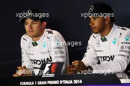 (L to R): Nico Rosberg (GER) Mercedes AMG F1 with team mate Lewis Hamilton (GBR) Mercedes AMG F1 in the post qualifying FIA Press Conference. 06.09.2014. Formula 1 World Championship, Rd 13, Italian Grand Prix, Monza, Italy, Qualifying Day.