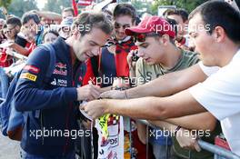 Jean-Eric Vergne (FRA) Scuderia Toro Rosso signs autographs for the fans. 06.09.2014. Formula 1 World Championship, Rd 13, Italian Grand Prix, Monza, Italy, Qualifying Day.