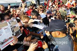 Lewis Hamilton (GBR) Mercedes AMG F1 signs autographs for the fans. 06.09.2014. Formula 1 World Championship, Rd 13, Italian Grand Prix, Monza, Italy, Qualifying Day.