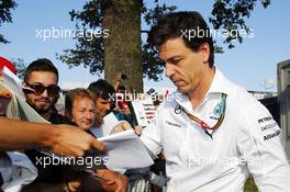 Toto Wolff (GER) Mercedes AMG F1 Shareholder and Executive Director signs autographs for the fans. 06.09.2014. Formula 1 World Championship, Rd 13, Italian Grand Prix, Monza, Italy, Qualifying Day.