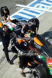 Sergio Perez (MEX) Sahara Force India F1 VJM07 in the pits. 06.09.2014. Formula 1 World Championship, Rd 13, Italian Grand Prix, Monza, Italy, Qualifying Day.