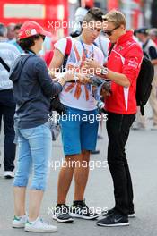 Max Chilton (GBR) Marussia F1 Team signs autographs for the fans. 07.09.2014. Formula 1 World Championship, Rd 13, Italian Grand Prix, Monza, Italy, Race Day.