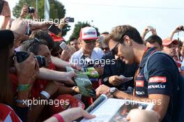Jean-Eric Vergne (FRA) Scuderia Toro Rosso signs autographs for the fans. 07.09.2014. Formula 1 World Championship, Rd 13, Italian Grand Prix, Monza, Italy, Race Day.