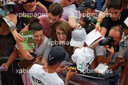 Lewis Hamilton (GBR) Mercedes AMG F1 with fans in the pit lane. 04.09.2014. Formula 1 World Championship, Rd 13, Italian Grand Prix, Monza, Italy, Preparation Day.