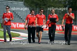 Jules Bianchi (FRA) Marussia F1 Team and Alexander Rossi (USA) Marussia F1 Team Reserve Driver (Left) walk the circuit. 04.09.2014. Formula 1 World Championship, Rd 13, Italian Grand Prix, Monza, Italy, Preparation Day.