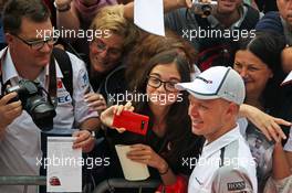 Kevin Magnussen (DEN) McLaren with fans. 04.09.2014. Formula 1 World Championship, Rd 13, Italian Grand Prix, Monza, Italy, Preparation Day.