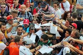 Jenson Button (GBR) McLaren signs autographs for the fans. 04.09.2014. Formula 1 World Championship, Rd 13, Italian Grand Prix, Monza, Italy, Preparation Day.