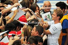 Nico Rosberg (GER) Mercedes AMG F1 signs autographs for the fans. 04.09.2014. Formula 1 World Championship, Rd 13, Italian Grand Prix, Monza, Italy, Preparation Day.
