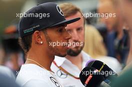 Lewis Hamilton (GBR) Mercedes AMG F1 with the media. 04.09.2014. Formula 1 World Championship, Rd 13, Italian Grand Prix, Monza, Italy, Preparation Day.