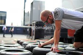 McLaren mechanic marks Pirelli tyres in the pits. 04.09.2014. Formula 1 World Championship, Rd 13, Italian Grand Prix, Monza, Italy, Preparation Day.