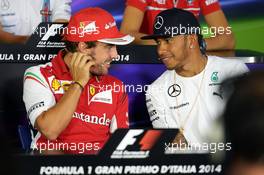(L to R): Fernando Alonso (ESP) Ferrari and Lewis Hamilton (GBR) Mercedes AMG F1 in the FIA Press Conference. 04.09.2014. Formula 1 World Championship, Rd 13, Italian Grand Prix, Monza, Italy, Preparation Day.