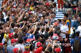 Nico Rosberg (GER) Mercedes AMG F1 with fans in the pit lane. 04.09.2014. Formula 1 World Championship, Rd 13, Italian Grand Prix, Monza, Italy, Preparation Day.