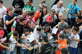 Sergio Perez (MEX) Sahara Force India F1 signs autographs for the fans. 04.09.2014. Formula 1 World Championship, Rd 13, Italian Grand Prix, Monza, Italy, Preparation Day.