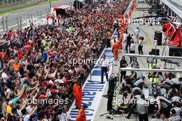Fans in the pit lane. 04.09.2014. Formula 1 World Championship, Rd 13, Italian Grand Prix, Monza, Italy, Preparation Day.