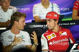 (L to R): Nico Rosberg (GER) Mercedes AMG F1 and Fernando Alonso (ESP) Ferrari in the FIA Press Conference. 04.09.2014. Formula 1 World Championship, Rd 13, Italian Grand Prix, Monza, Italy, Preparation Day.