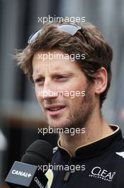 Romain Grosjean (FRA) Lotus F1 Team with the media. 04.09.2014. Formula 1 World Championship, Rd 13, Italian Grand Prix, Monza, Italy, Preparation Day.