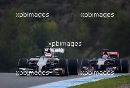 Adrian Sutil (GER), Sauber F1 Team and Daniil Kvyat (RUS), Scuderia Toro Rosso  31.01.2014. Formula One Testing, Day Four, Jerez, Spain.