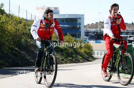 (L to R): Pedro De La Rosa (ESP) Ferrari Development Driver cycles the perimiter road with Massimo Rivola (ITA) Ferrari Sporting Director. 30.01.2014. Formula One Testing, Day Three, Jerez, Spain.