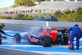 The Scuderia Toro Rosso STR9 of Jean-Eric Vergne (FRA) Scuderia Toro Rosso is tended to by marshals after stopping on the start/finish straight. 30.01.2014. Formula One Testing, Day Three, Jerez, Spain.