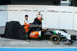 (L to R): Sergio Perez (MEX) Sahara Force India F1 and team mate Nico Hulkenberg (GER) Sahara Force India F1 unveil the new Sahara Force India F1 VJM07. 28.01.2014. Formula One Testing, Day One, Jerez, Spain.