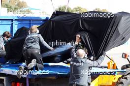 The Mercedes AMG F1 W05 of Lewis Hamilton (GBR) Mercedes AMG F1 is recovered back to the pits on the back of a truck after he crashed at the first corner. 28.01.2014. Formula One Testing, Day One, Jerez, Spain.