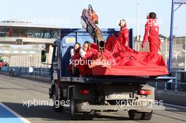The Ferrari F14-T of Kimi Raikkonen (FIN) Ferrari is recovered back to the pits on the back of a truck. 28.01.2014. Formula One Testing, Day One, Jerez, Spain.