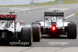 Lewis Hamilton (GBR), Mercedes AMG F1 Team and Pastor Maldonado (VEN), Lotus F1 Team  03.10.2014. Formula 1 World Championship, Rd 15, Japanese Grand Prix, Suzuka, Japan, Practice Day.