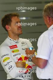 (L to R): Sebastian Vettel (GER) Red Bull Racing with Dr Helmut Marko (AUT) Red Bull Motorsport Consultant. 03.10.2014. Formula 1 World Championship, Rd 15, Japanese Grand Prix, Suzuka, Japan, Practice Day.