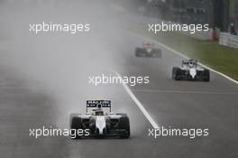 Valtteri Bottas (FIN) Williams FW36 exits the pits ahead of team mate Felipe Massa (BRA) Williams FW36. 05.10.2014. Formula 1 World Championship, Rd 15, Japanese Grand Prix, Suzuka, Japan, Race Day.