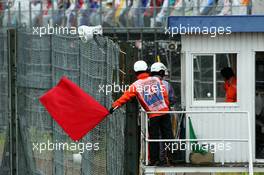 The race is stopped as marshals wave the red flag. 05.10.2014. Formula 1 World Championship, Rd 15, Japanese Grand Prix, Suzuka, Japan, Race Day.