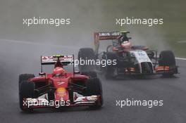 Kimi Raikkonen (FIN) Ferrari F14-T leads Sergio Perez (MEX) Sahara Force India F1 VJM07. 05.10.2014. Formula 1 World Championship, Rd 15, Japanese Grand Prix, Suzuka, Japan, Race Day.