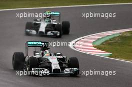 Lewis Hamilton (GBR) Mercedes AMG F1 W05 leads team mate Nico Rosberg (GER) Mercedes AMG F1 W05. 05.10.2014. Formula 1 World Championship, Rd 15, Japanese Grand Prix, Suzuka, Japan, Race Day.