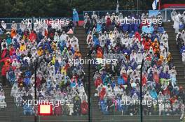 Fans in the grandstand as the race is stopped. 05.10.2014. Formula 1 World Championship, Rd 15, Japanese Grand Prix, Suzuka, Japan, Race Day.
