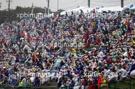 Fans in the grandstand. 05.10.2014. Formula 1 World Championship, Rd 15, Japanese Grand Prix, Suzuka, Japan, Race Day.